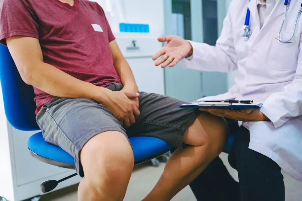 Male patient speaking with a healthcare provider during an appointment