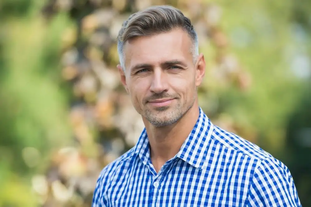 Portrait of a smiling middle-aged man outdoors